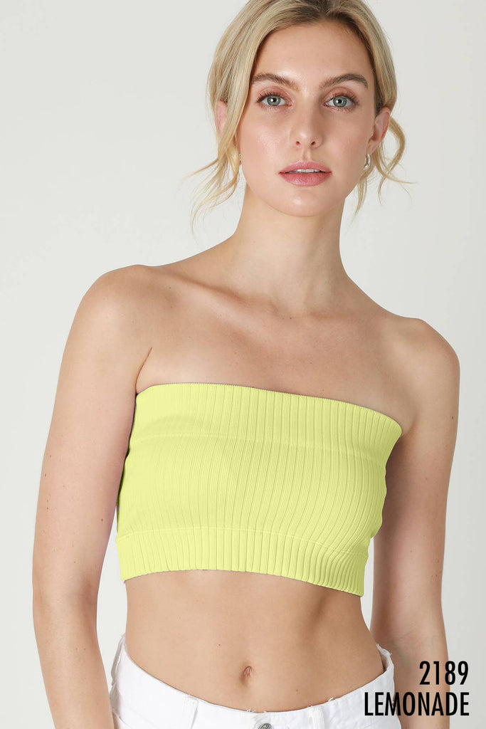 Woman wearing Radiance Ribbed Bandeau Top in a bright yellow color, featuring a comfortable, stretchy ribbed fabric.