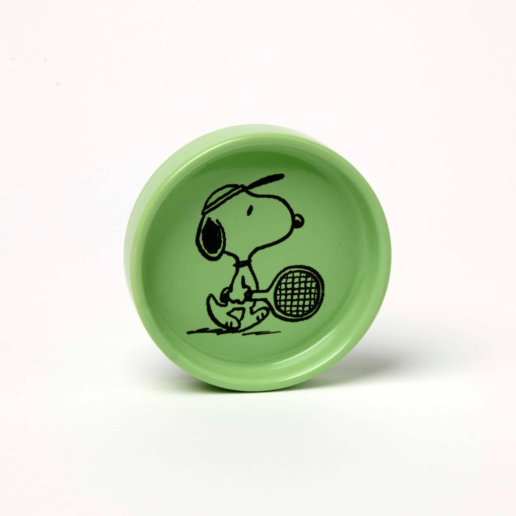 Green Snoopy pin dish with Snoopy holding a tennis racket.