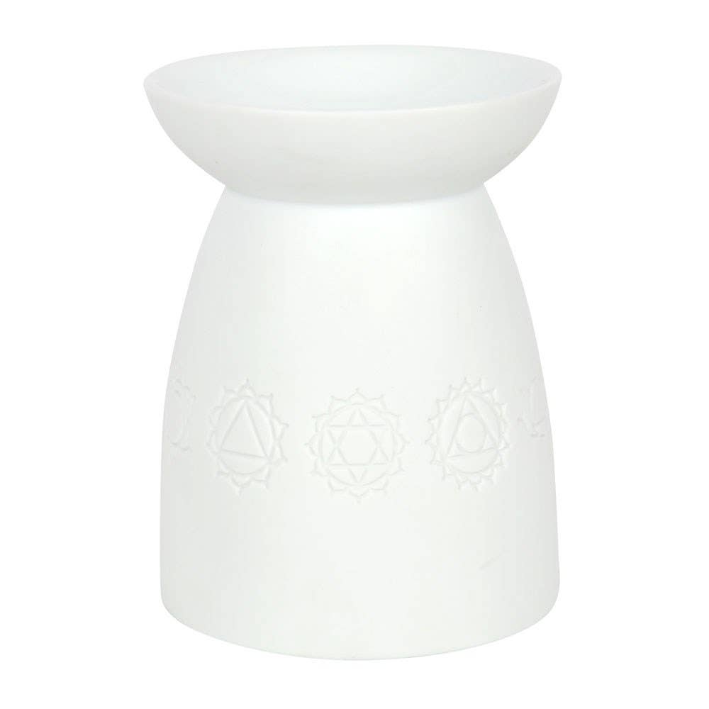 White stoneware essential oil burner with engraved moon phase design.