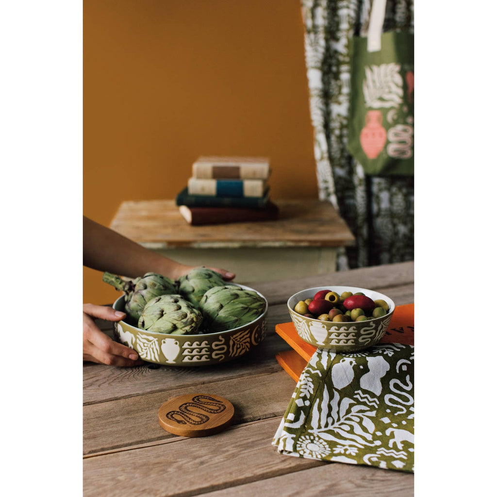 Artisan Stoneware Low Profile Bowl featuring intricate designs around the ring, perfect for dining or decor.