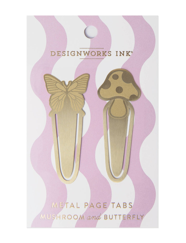 A set of two brass metal page tabs in butterfly and mushroom shapes, packaged on a pastel pink and white wavy background.