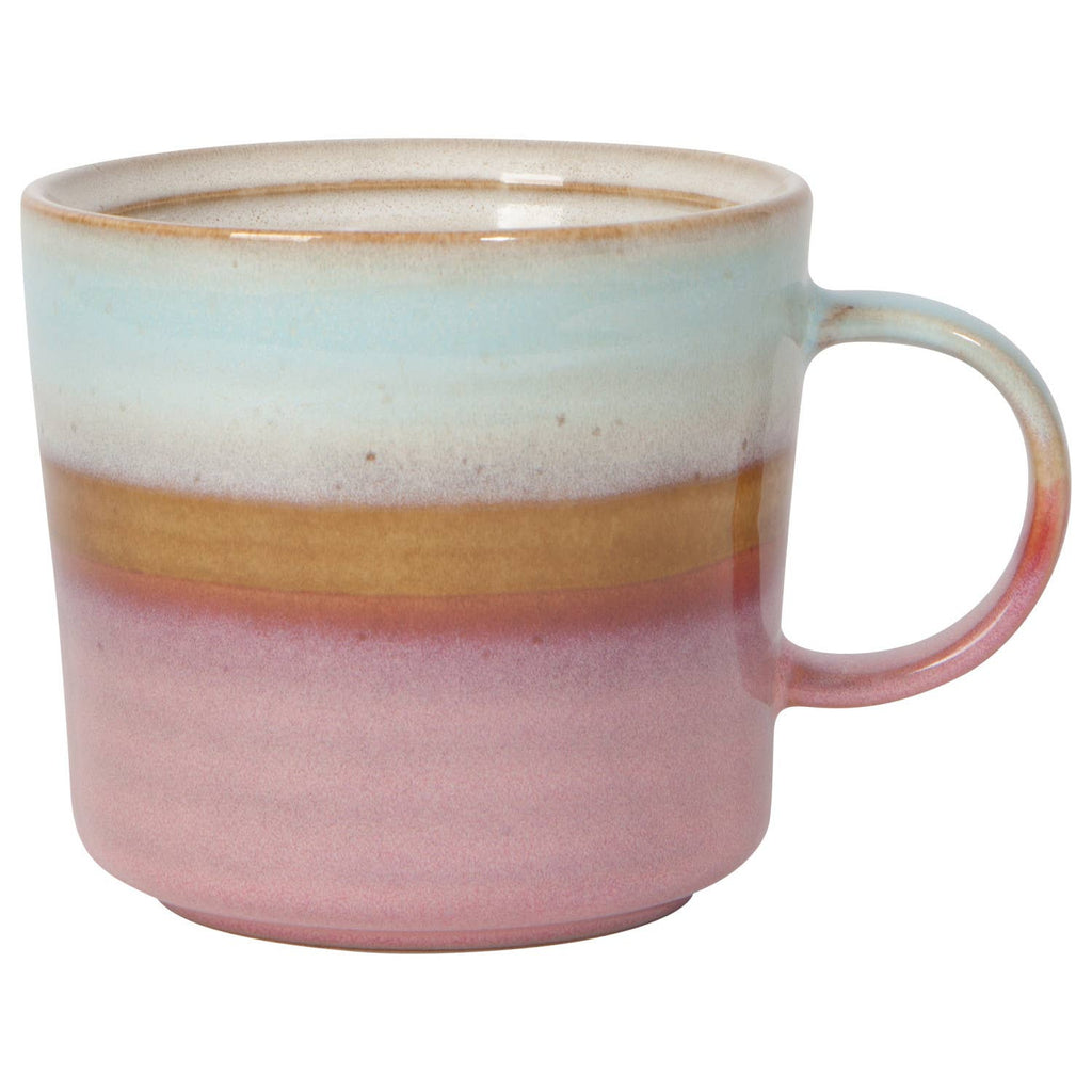 A ceramic mug with a gradient design featuring soft blue, gold, and pink tones, and a smooth finish.