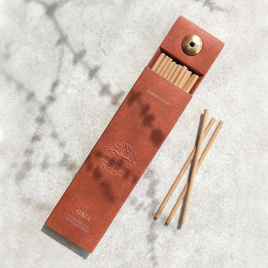Gaia natural incense sticks in a terracotta box with an embossed tree design and built-in holder for relaxation and grounding.