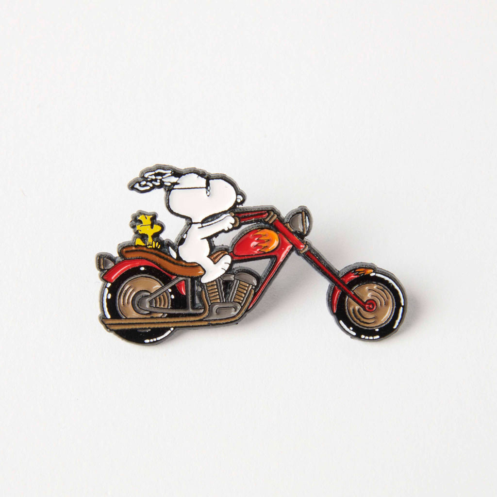 Snoopy and Woodstock enamel pin on a red motorcycle, perfect for Peanuts fans and motorcycle enthusiasts.