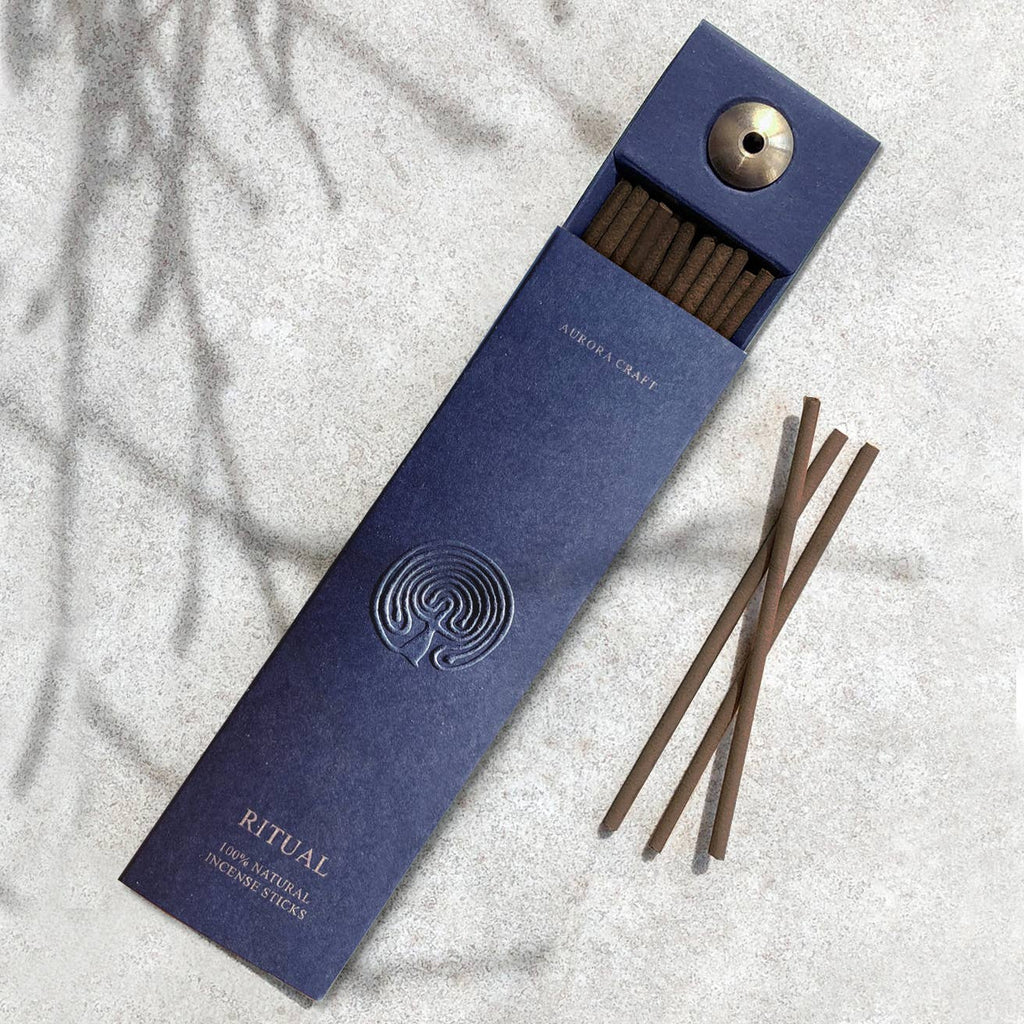 Elegant blue box of natural incense sticks with embossed detailing and a built-in holder, perfect for relaxation and mindfulness.