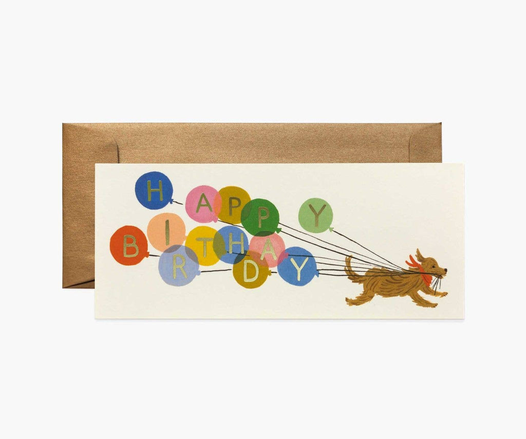 "Happy Birthday" card with colorful balloons spelling out the message, being pulled by a running dog, paired with a kraft envelope.