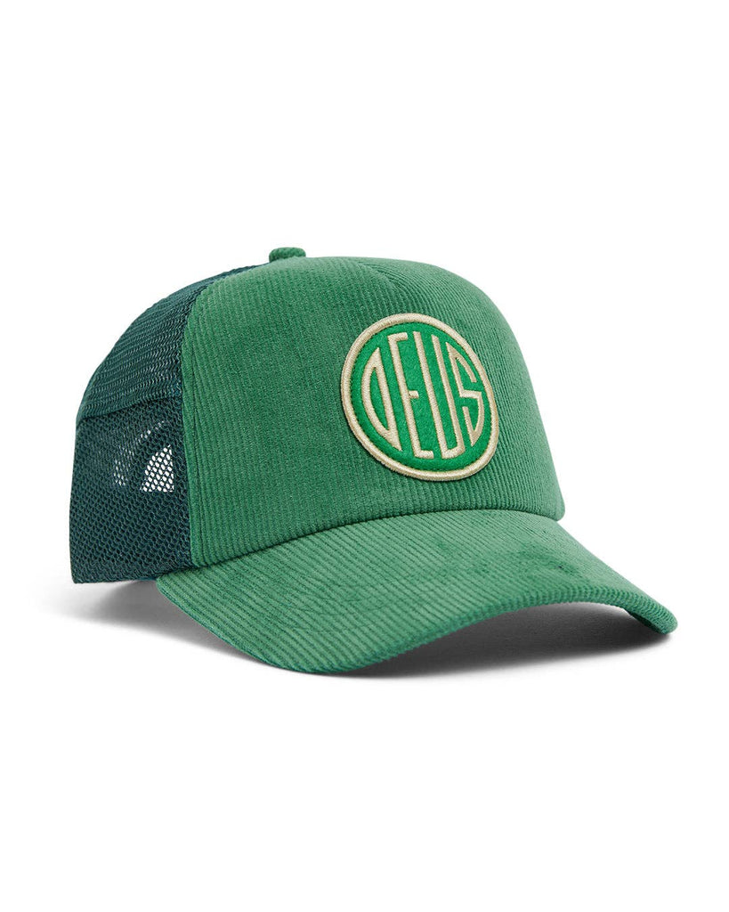 Green Deus Ex Machina corduroy trucker cap with a retro embroidered logo and mesh back.