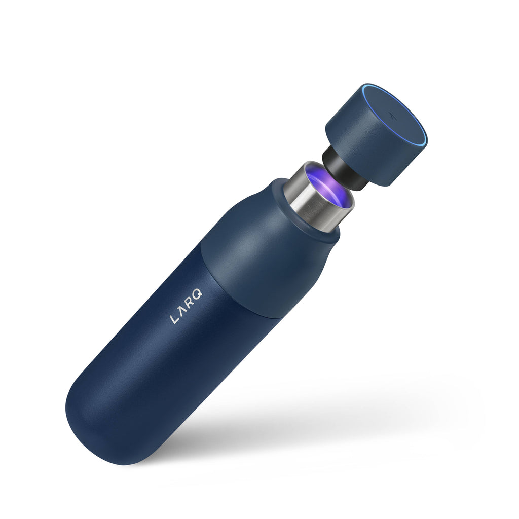 Navy blue LARQ bottle with UV light activating from the cap.