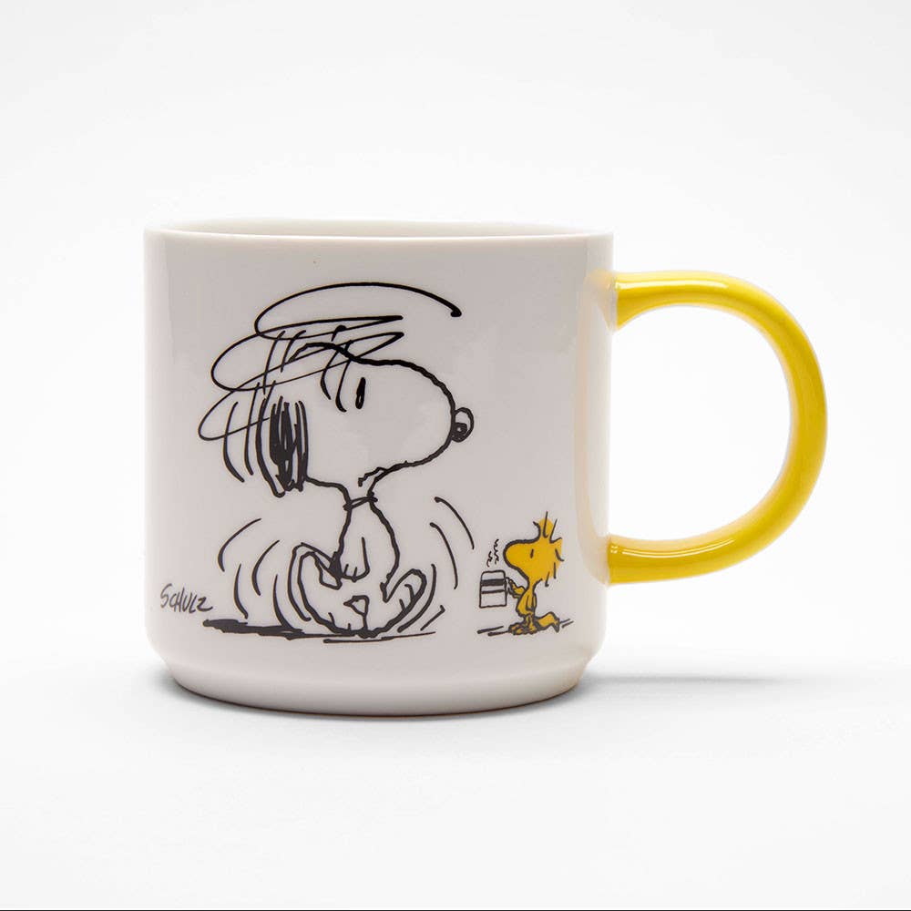 Ceramic mug featuring a scribbly Snoopy and Woodstock with a yellow handle, designed with a humorous pre-coffee theme.