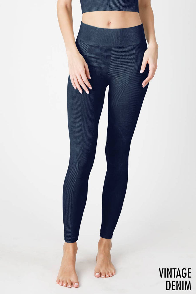 Woman wearing Serenity High-Waist Ribbed Leggings in vintage cool grey, featuring a high-rise waistband and ribbed texture for a sleek, supportive fit.