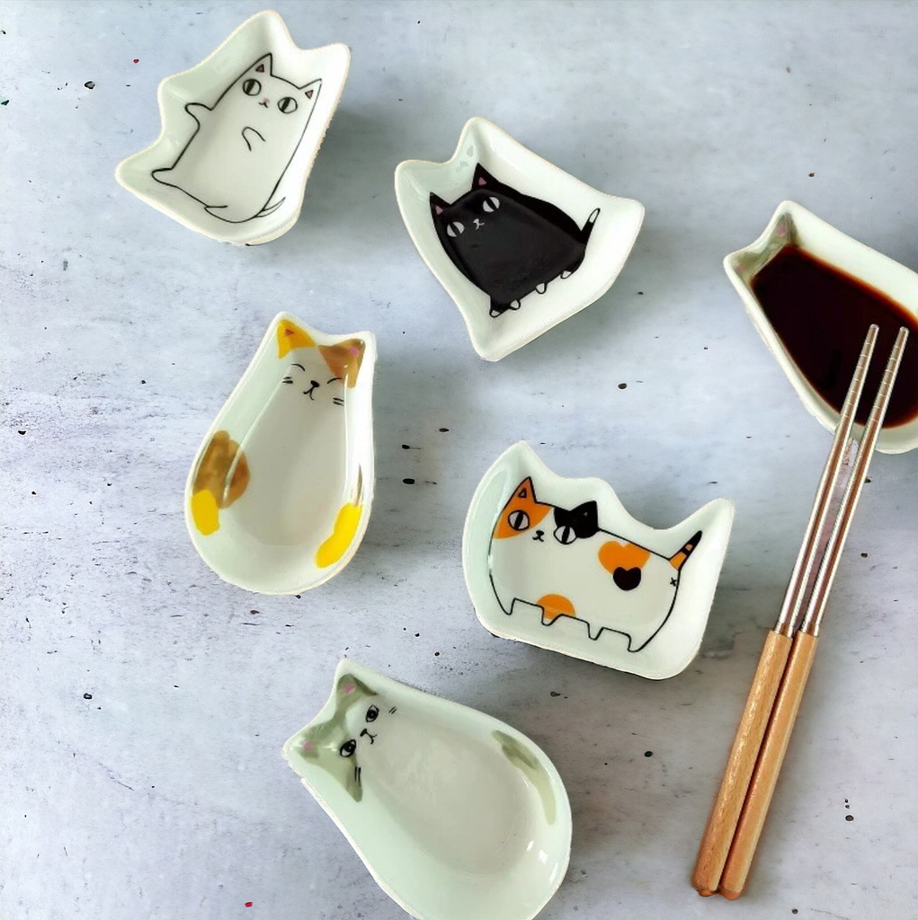 A set of Japanese Style Cat Ceramic Dishes with various adorable cat designs, perfect for serving soy sauce or small snacks.