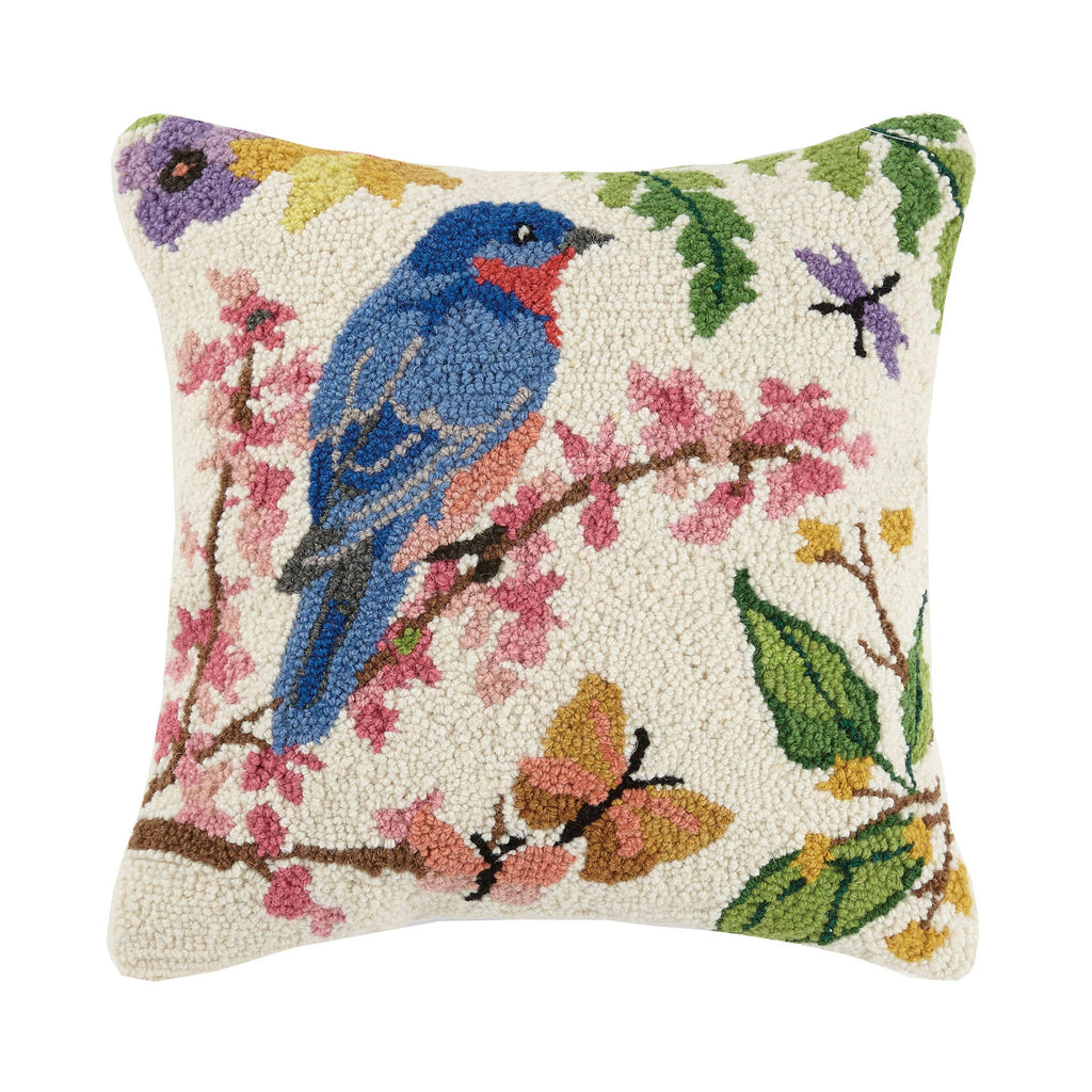 Bluebird hook pillow with a vibrant bird perched on a floral branch, featuring detailed wool embroidery.