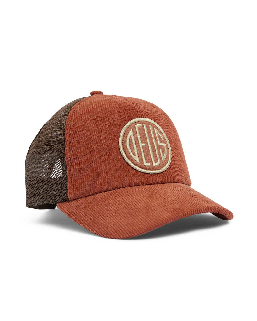 Rust corduroy trucker cap with an embroidered logo and breathable mesh back.