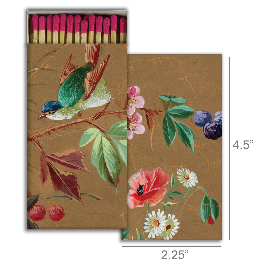 Nature-inspired decorative matchbox with bird, flowers, and berries on kraft paper background.