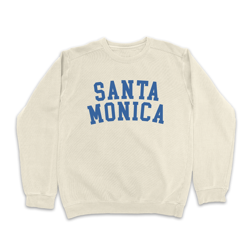 Cream "Santa Monica" sweatshirt with bold blue text on a plain white background.