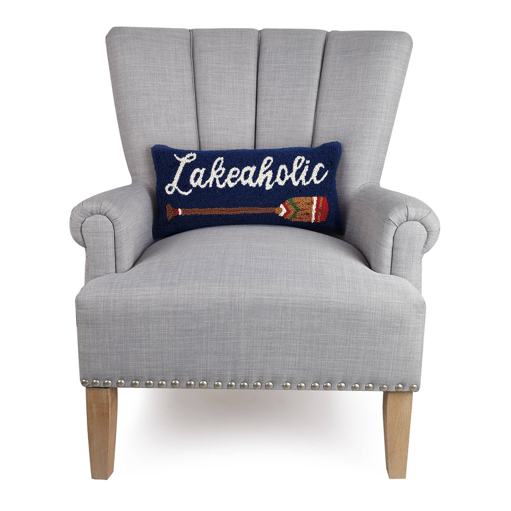 Lakeaholic hook pillow with a deep blue background, white "Lakeaholic" script, and a colorful paddle graphic.