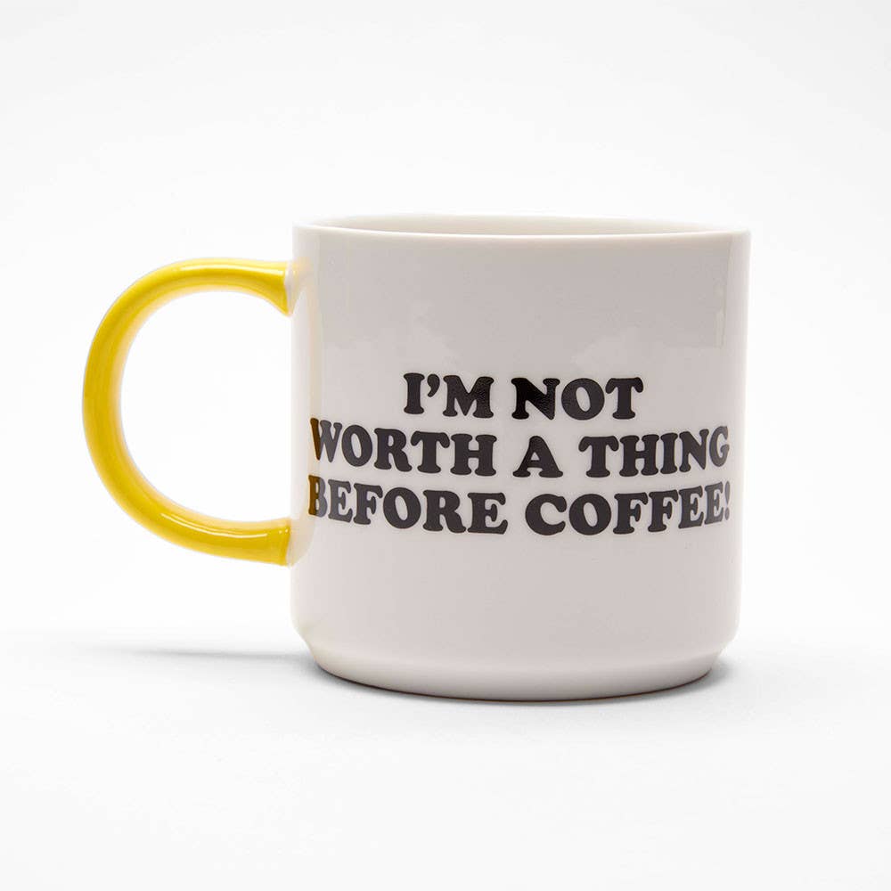 Ceramic mug with the phrase "I'm Not Worth A Thing Before Coffee!" in bold black letters on a white background, paired with a yellow handle.