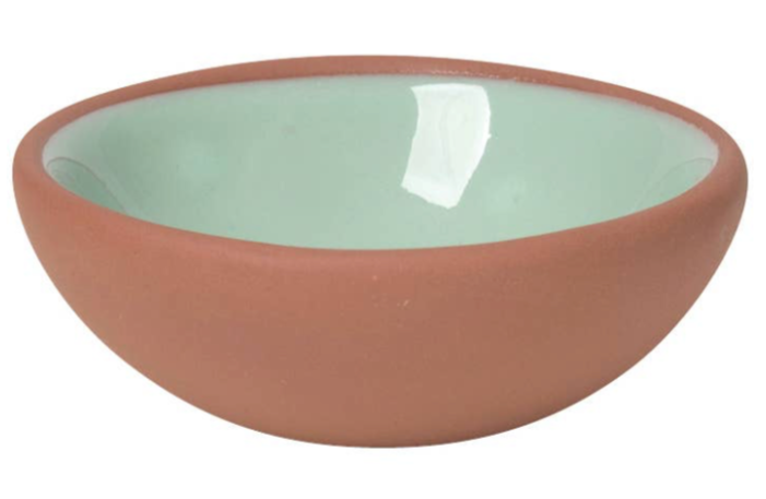 Set of six terracotta pinch bowls with contrasting glossy interiors in soft pastels and rich hues, perfect for holding spices, salt, or nuts.