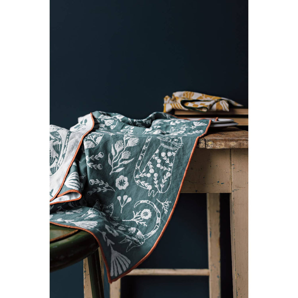 Olympus Imprint Double-Layer Dish Towel featuring intricate Greek-inspired motifs on an earthy background with a loose weave for quick drying.