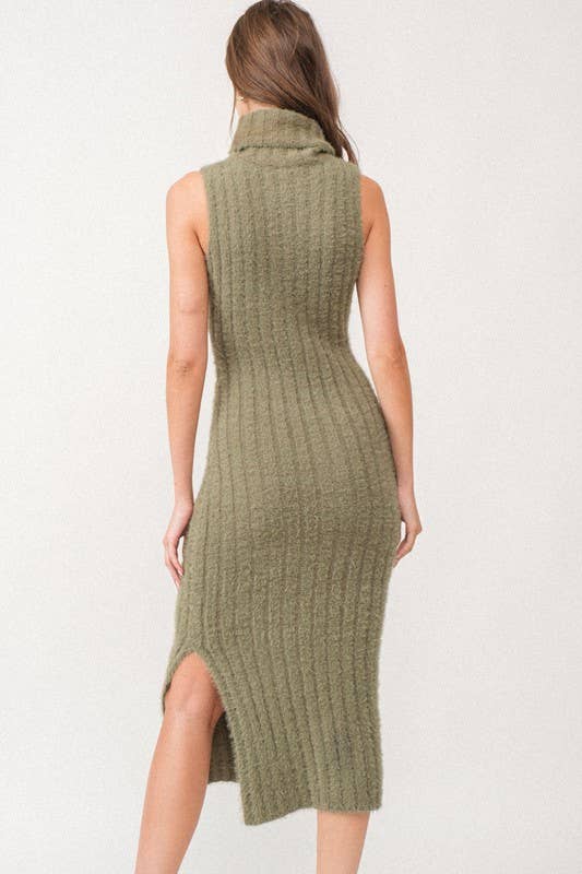 Woman wearing a sleeveless white turtle neck rib-knit midi dress.