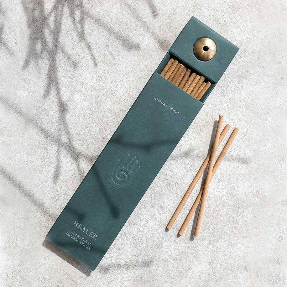 Natural incense sticks in a stylish green box with a built-in holder, designed for relaxation and mindfulness.