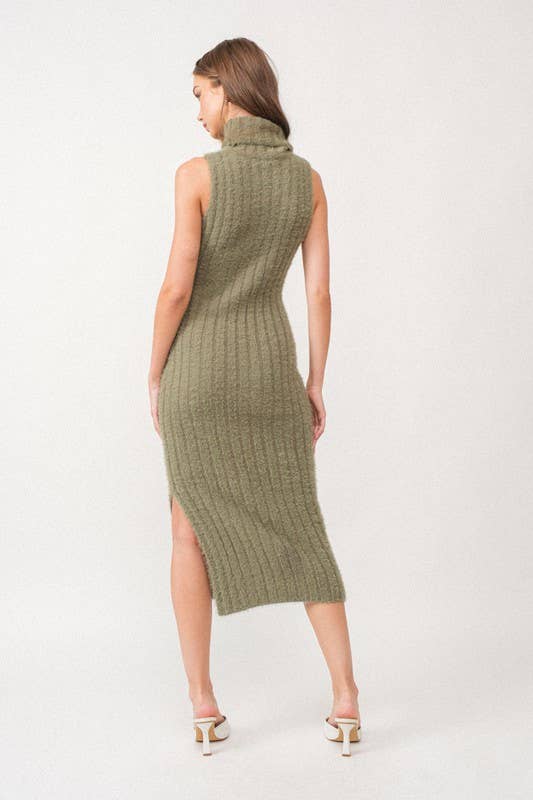 Woman wearing a sleeveless white turtle neck rib-knit midi dress.