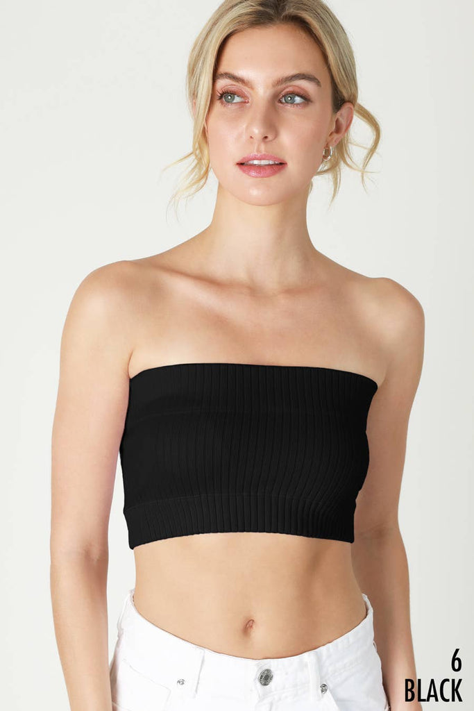 Woman wearing Radiance Ribbed Bandeau Top in a bright yellow color, featuring a comfortable, stretchy ribbed fabric.