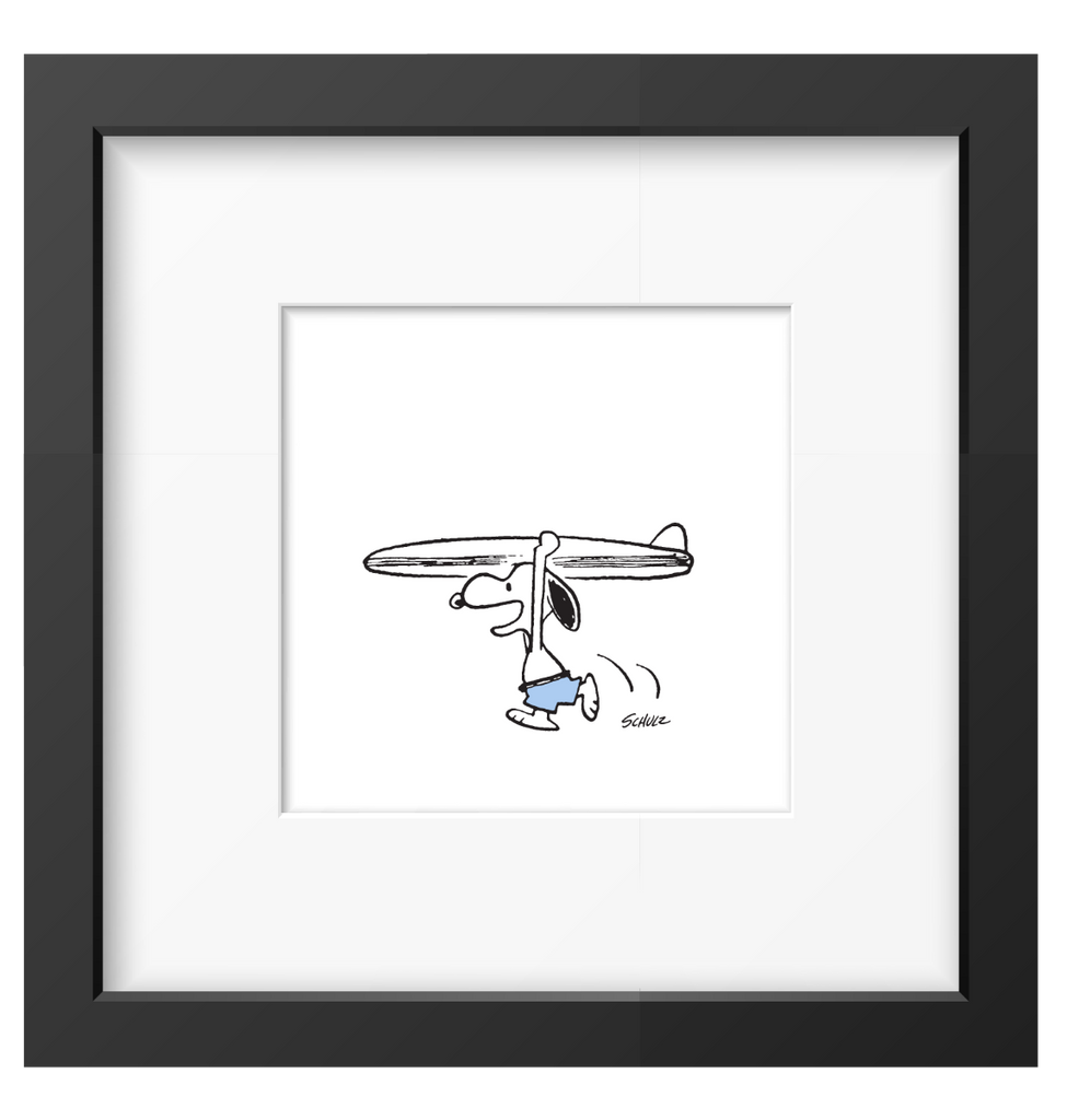 Framed artwork of Snoopy carrying a surfboard, ideal decor for Peanuts fans and beach lovers.