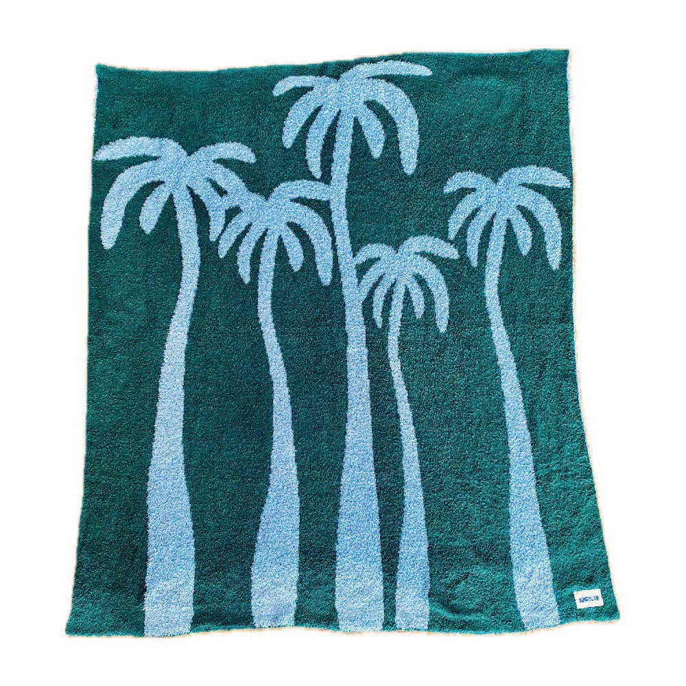 A teal and light blue throw blanket featuring a palm tree design, made of soft and plush material.