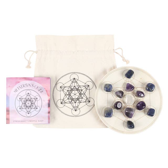 Metatron’s Cube Crystal Grid Set with Sodalite and Amethyst Tumblestones on an Engraved Wooden Grid, surrounded by candles and other crystals.