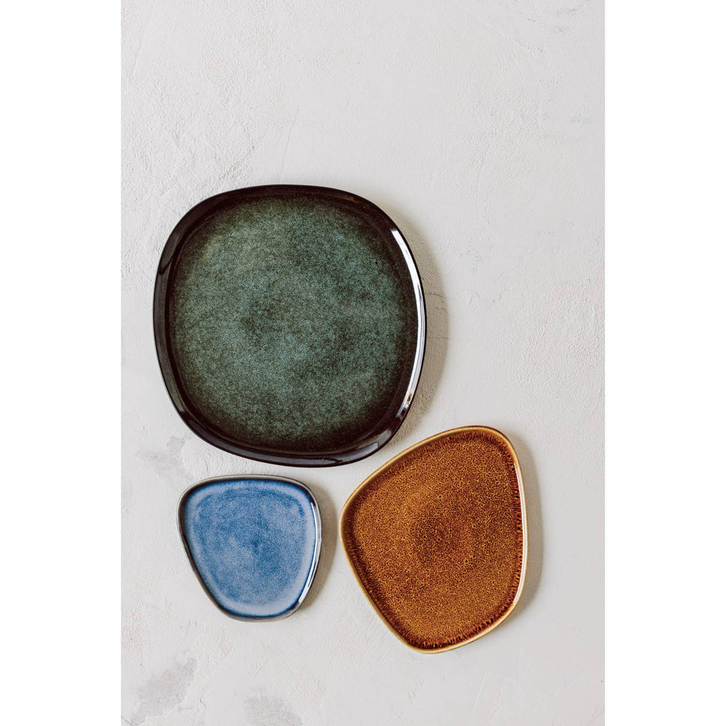 Tumble Plate with a smooth, polished surface in warm, earthy tones, inspired by the natural beauty of tumbled stones.