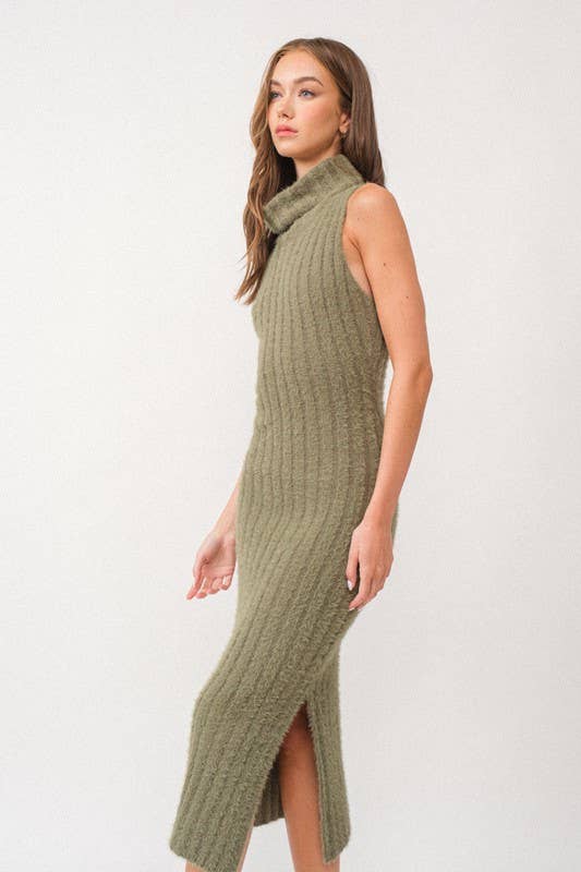 Woman wearing a sleeveless white turtle neck rib-knit midi dress.