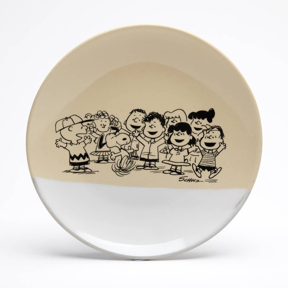 Peanuts dish featuring Charlie Brown, Snoopy, and friends, ideal for decor or serving snacks.